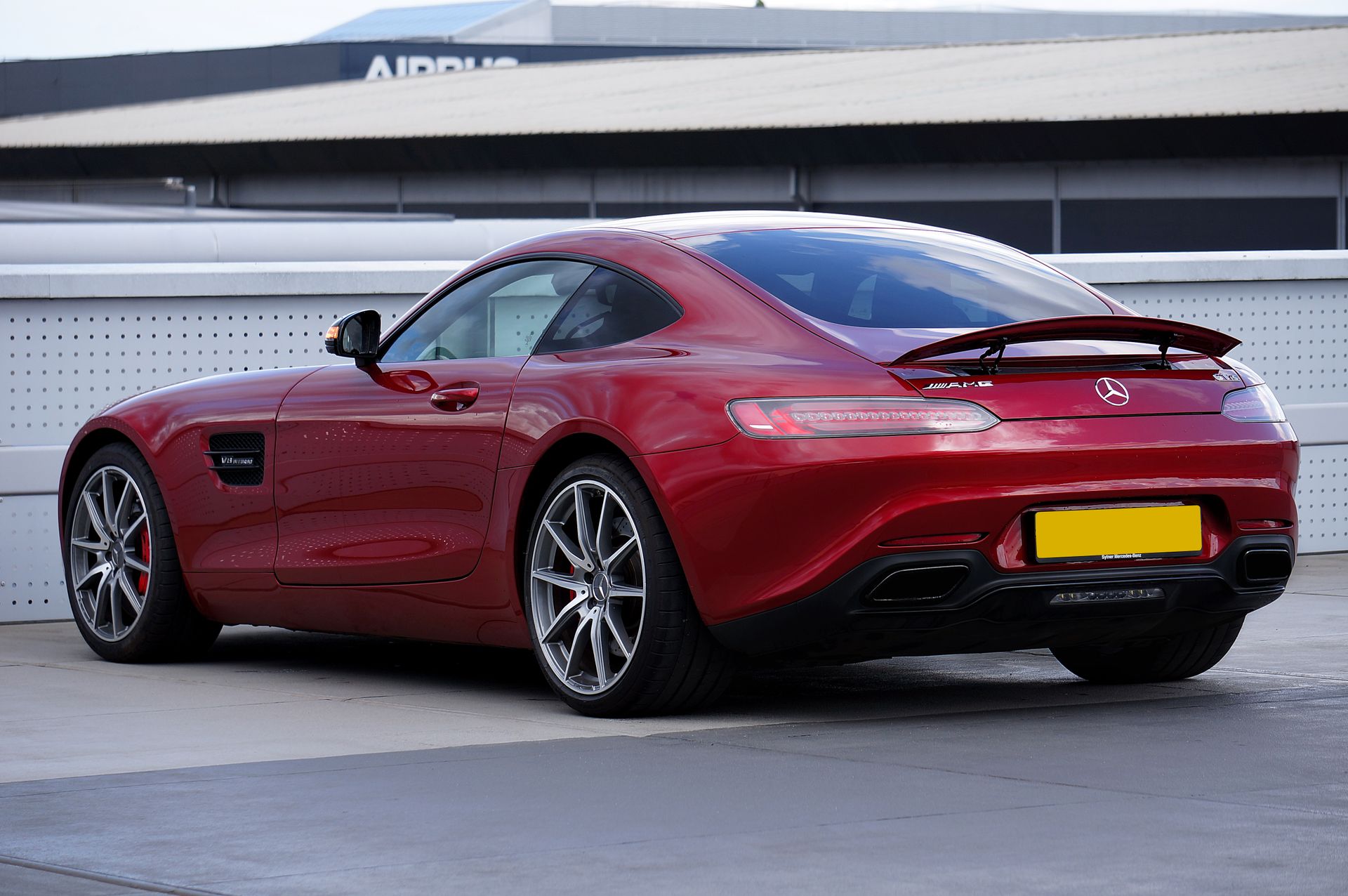 Red Mercedes-AMG GT with tinted windows