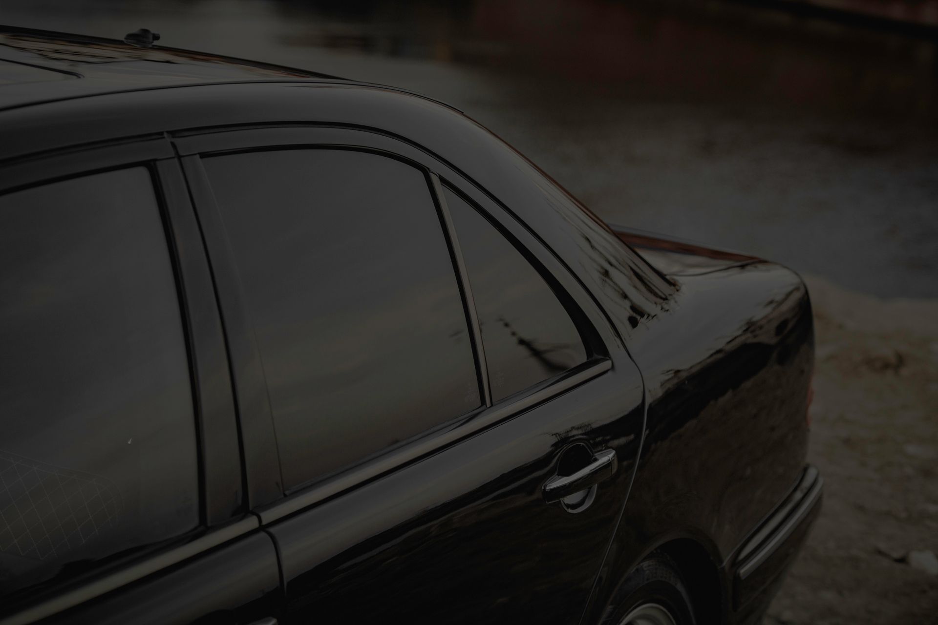 Black Mercedes sedan with professionally tinted windows